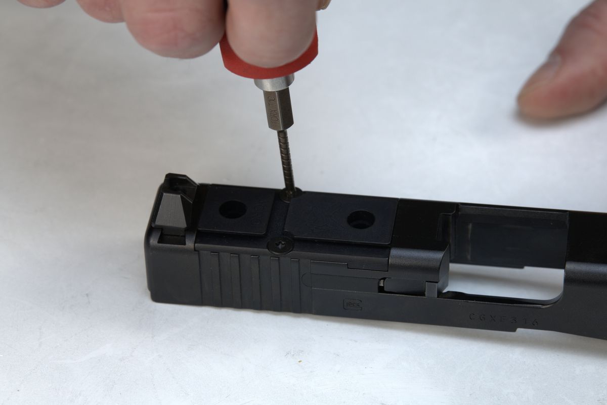 Torx driver securing Acro plate screws to Glock slide
